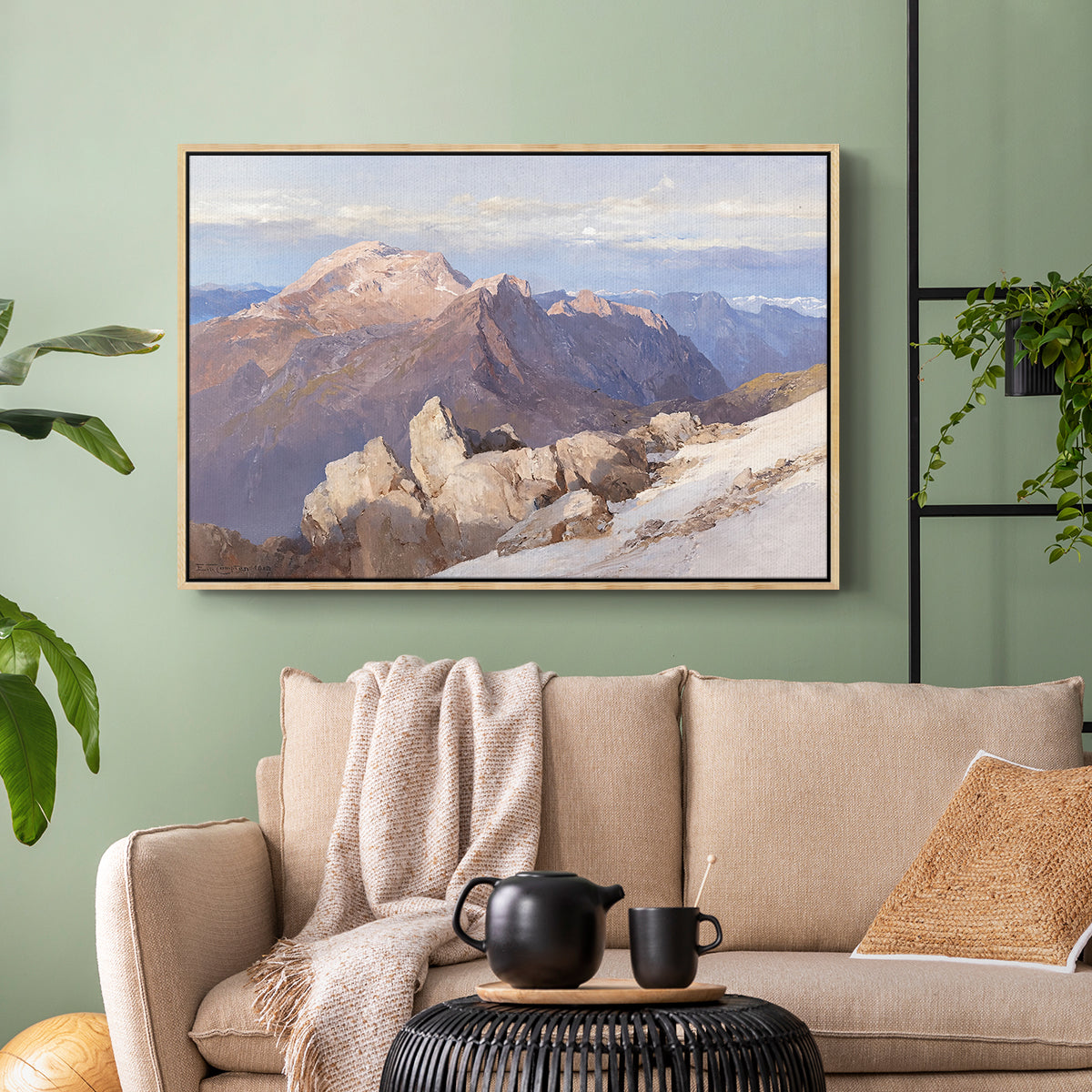 Natural wood floater framed canvas featuring an expansive mountainous landscape with natural depth, displayed above a sofa in a modern living room.
