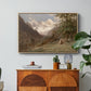 Landscape in the Caucasus, c. 1921 by Edward Theodore Compton in a natural wood floater framed canvas featuring a mountainous landscape with rugged terrain and distant peaks, displayed above a wood console cabinet.