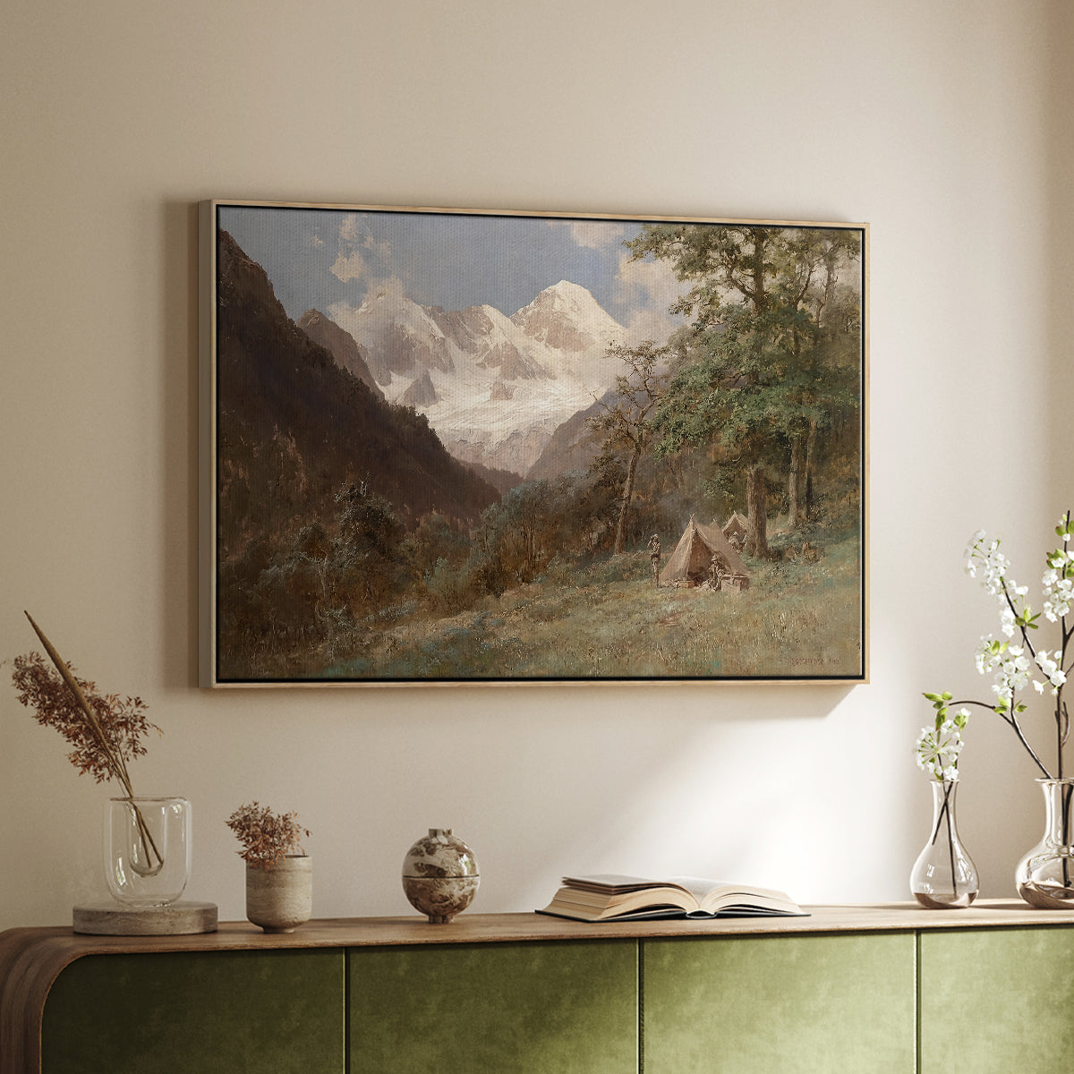 Natural wood floater framed canvas of Landscape in the Caucasus, c. 1921 by Edward Theodore Compton, featuring an expansive view of Caucasus mountains under open sky above a sideboard in a softly lit hallway.