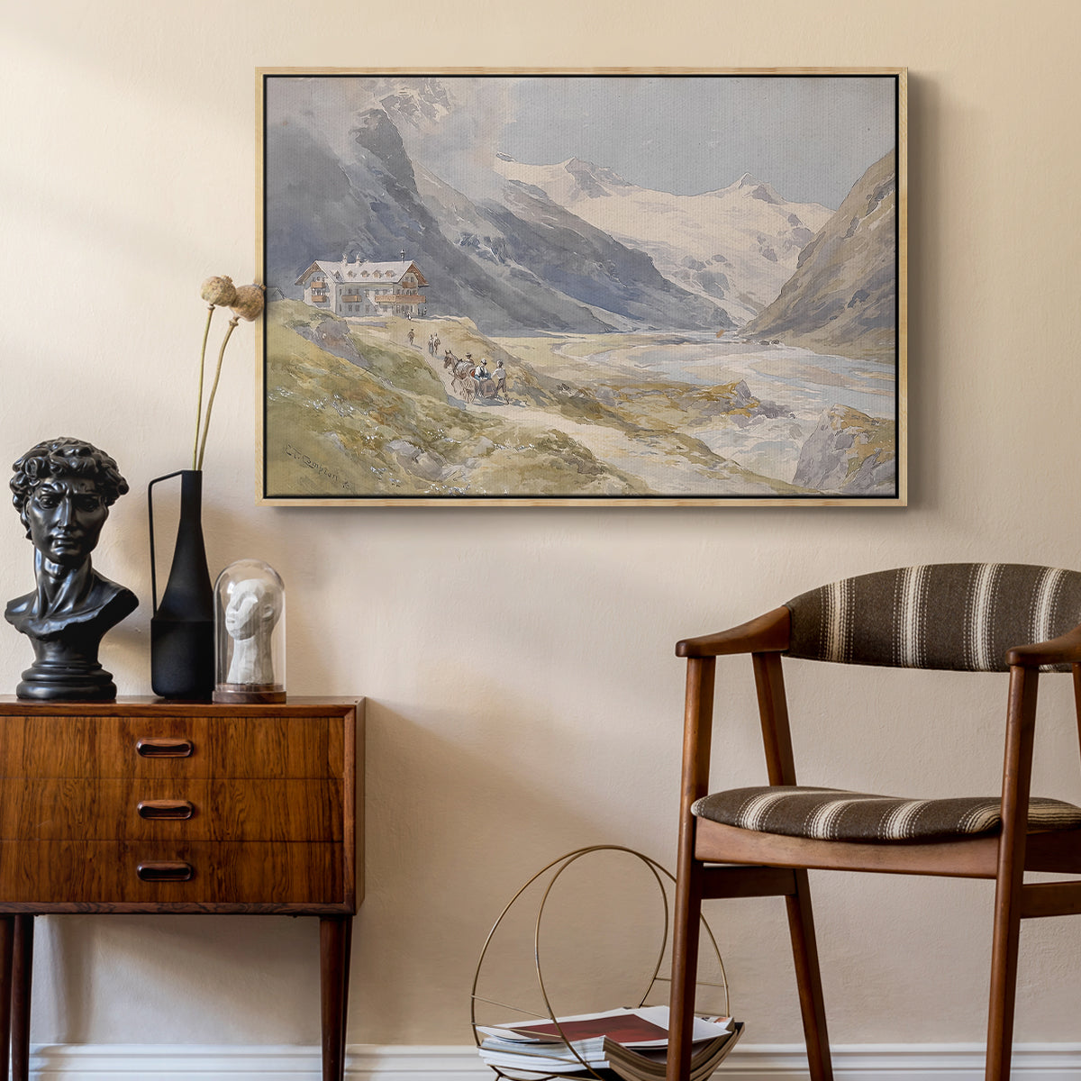 Shepherds (Pasterze), c. 1921 by Edward Theodore Compton as a natural wood floater framed canvas featuring a rural alpine setting with shepherds and open terrain, styled above a mid-century console in a contemporary living area.
