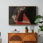 Cardinal and Nun (Caress), 1912 by Egon Schiele in a natural wood floater framed canvas featuring two figures embracing intimately in stylized expressionist composition, displayed above a wood console cabinet.
