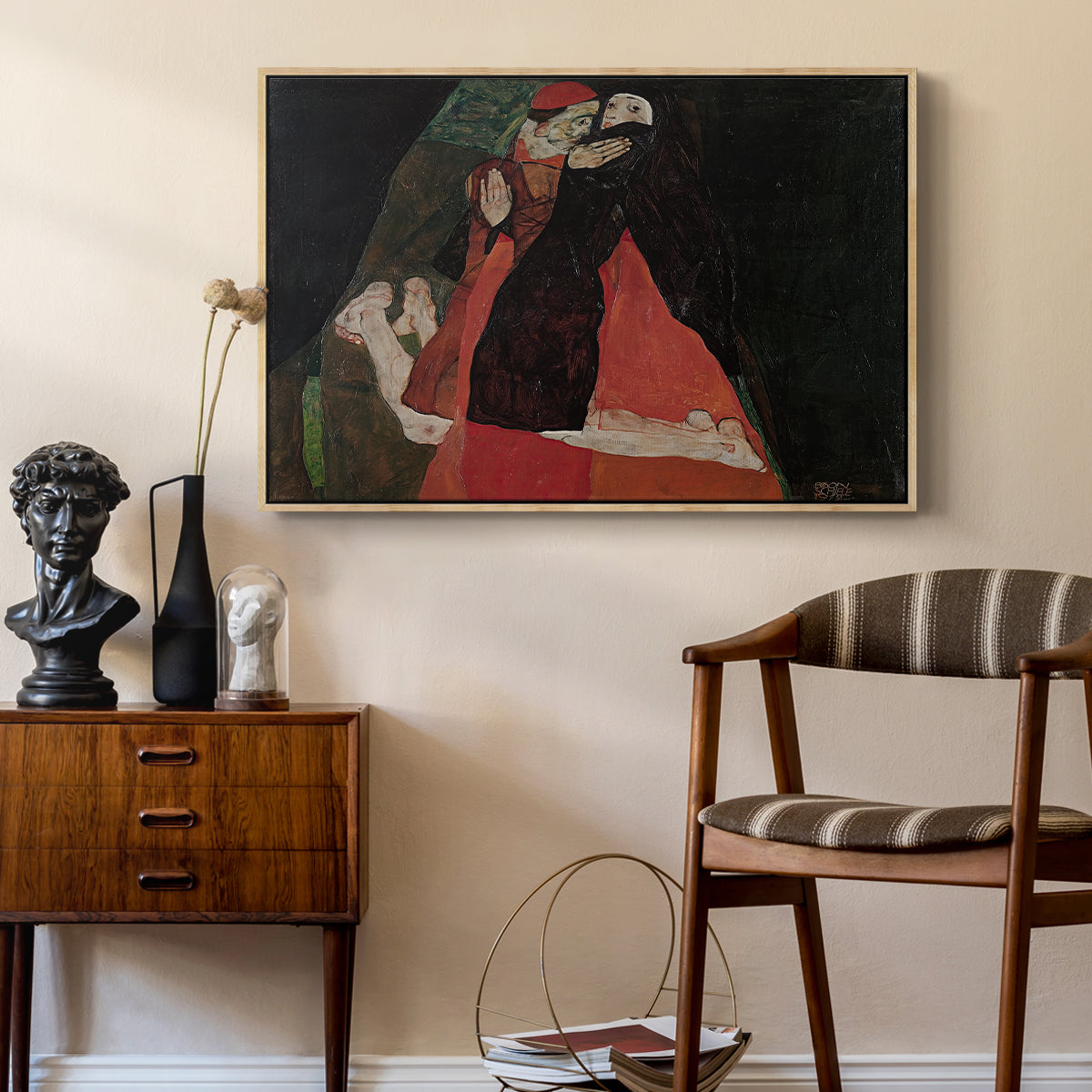 Cardinal and Nun (Caress), 1912 by Egon Schiele as a natural wood floater framed canvas featuring an expressive painting of figures entwined with bold lines and color, styled above a mid-century console in a contemporary living area.