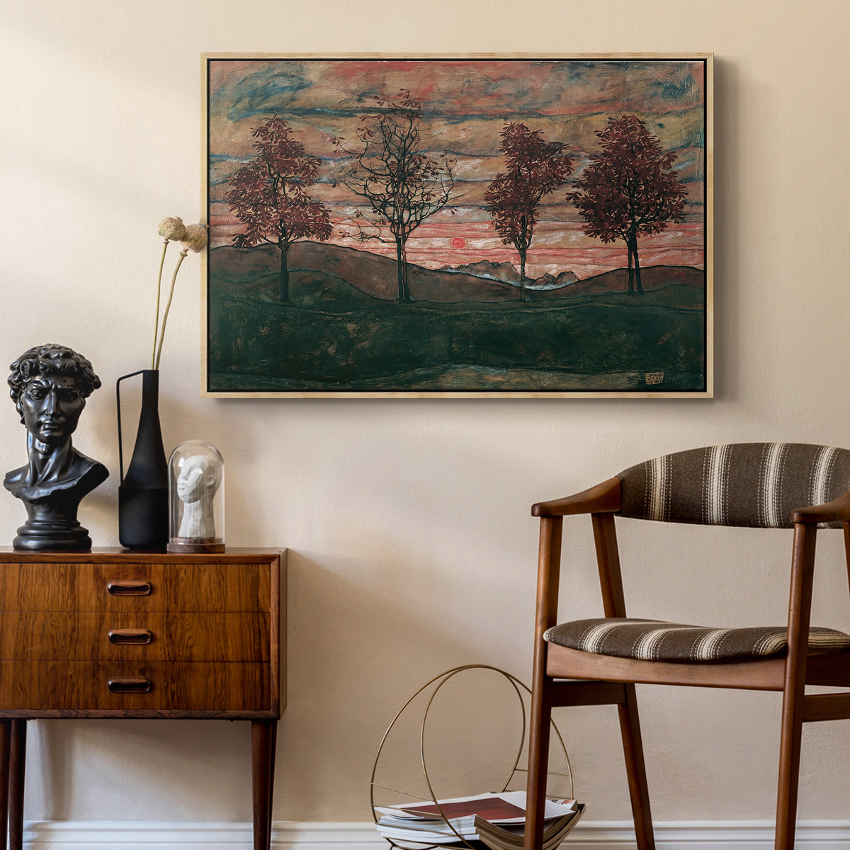 Four Trees, 1917 by Egon Schiele as a natural wood floater framed canvas featuring a stylized nature scene with strong outlines and simple composition, styled above a mid-century console in a contemporary living area.