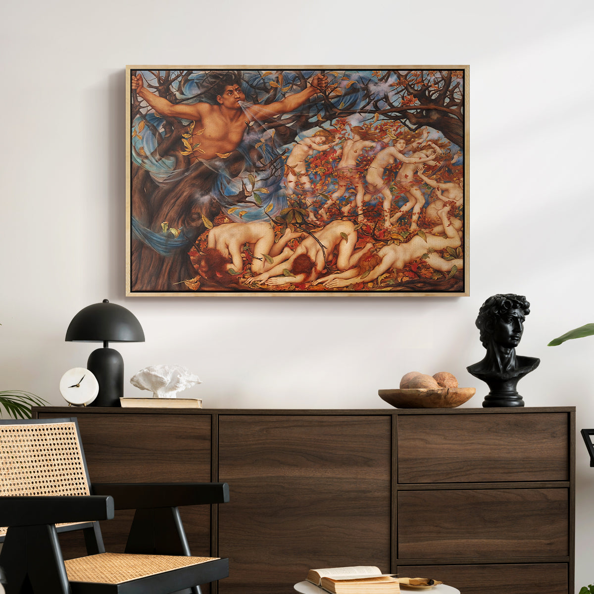 Boreas and the Fallen Leaves, c. 1910-1914 by Evelyn De Morgan displayed in a natural wood floater framed canvas above a dark wood credenza in an entryway.