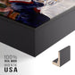 Close-up of the black floater frame corner and gallery wrapped canvas construction.
