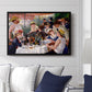 Luncheon of the Boating Party (Le Déjeuner des canotiers), 1880-1881 by Pierre-Auguste Renoir displayed above a sofa in a living room in a black floater frame, featuring a lively gathering of men and women eating and socializing at outdoor table.