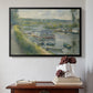 Black floater framed canvas featuring Wash-House Boat at Bas-Meudon, c. 1874 by Pierre-Auguste Renoir above an entryway table in a minimalist foyer.
