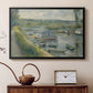 Black floater framed canvas featuring an impressionist depiction of working boat along calm waterway, displayed above a cabinet in a soft-toned living room.