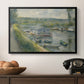 Wash-House Boat at Bas-Meudon, c. 1874 by Pierre-Auguste Renoir in a black floater framed canvas displayed above a console table in a hallway, featuring an everyday life scene with boat and figures along river edge.