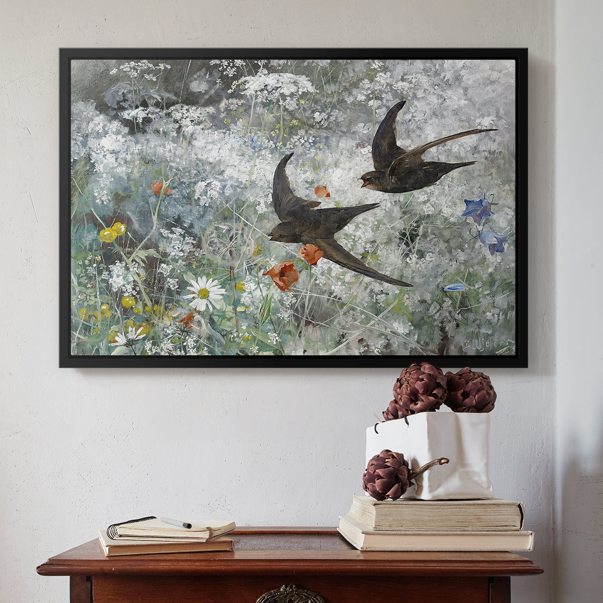 Black floater framed canvas featuring Common Swifts, 1886 by Bruno Liljefors above an entryway table in a minimalist foyer.