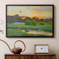 Black floater framed canvas featuring a wild duck gliding through a golden sunset sky, displayed above a cabinet in a soft-toned living room.