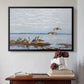 Black floater framed canvas featuring Greylag Geese (Grågäss), 1922 by Bruno Liljefors above an entryway table in a minimalist foyer.