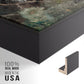 Close-up of the black floater frame corner and gallery wrapped canvas construction.