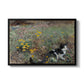 Cat on a Flowery Meadow, 1887 by Bruno Liljefors in a black floater framed canvas wall art display.