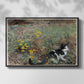 Front view of Cat on a Flowery Meadow, 1887 by Bruno Liljefors in a black floater framed canvas.