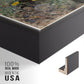 Close-up of the black floater frame corner and gallery wrapped canvas construction.