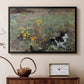 Black floater framed canvas featuring an animal scene of cat hidden in lush meadow vegetation, displayed above a cabinet in a soft-toned living room.