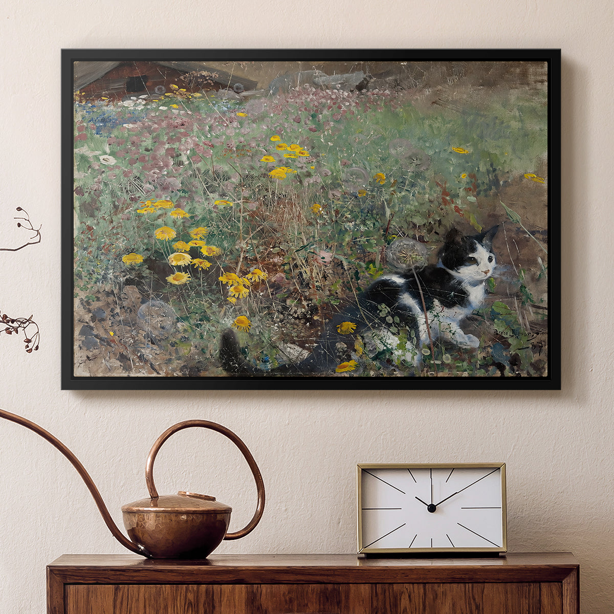 Black floater framed canvas featuring an animal scene of cat hidden in lush meadow vegetation, displayed above a cabinet in a soft-toned living room.