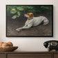 Portrait of a Dog, 1891 by Bruno Liljefors in a black floater framed canvas displayed above a console table in a hallway, featuring a calm scene of dog reclining in open landscape.