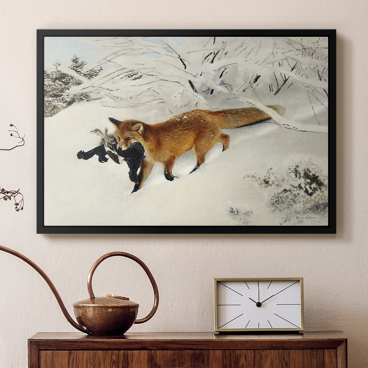 Black floater framed canvas featuring a red fox crossing snow-covered ground under pale sky, displayed above a cabinet in a soft-toned living room.