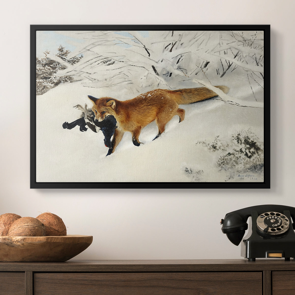Fox in Snow Landscape, 1900 by Bruno Liljefors in a black floater framed canvas displayed above a console table in a hallway, featuring a dynamic depiction of animal in cold snowy environment.