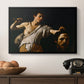 David with the Head of Goliath (Vienna Version), c. 1607 by Caravaggio in a black floater framed canvas displayed above a console table in a hallway, featuring an intense religious scene with figure emerging from darkness holding trophy.