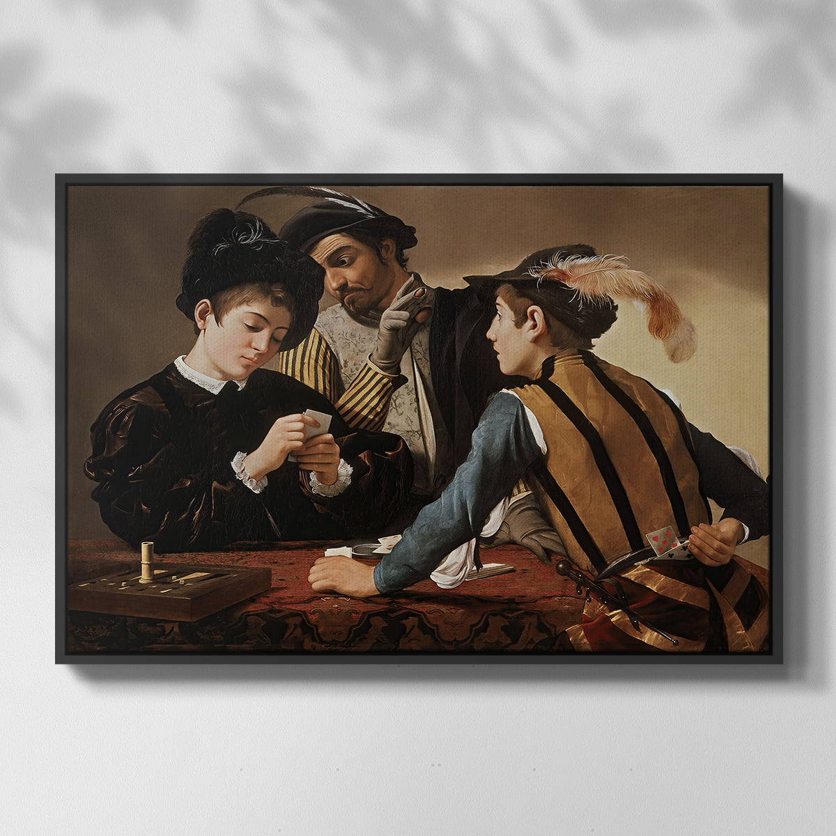 Front view of The Cardsharps, c. 1594 by Caravaggio in a black floater framed canvas.