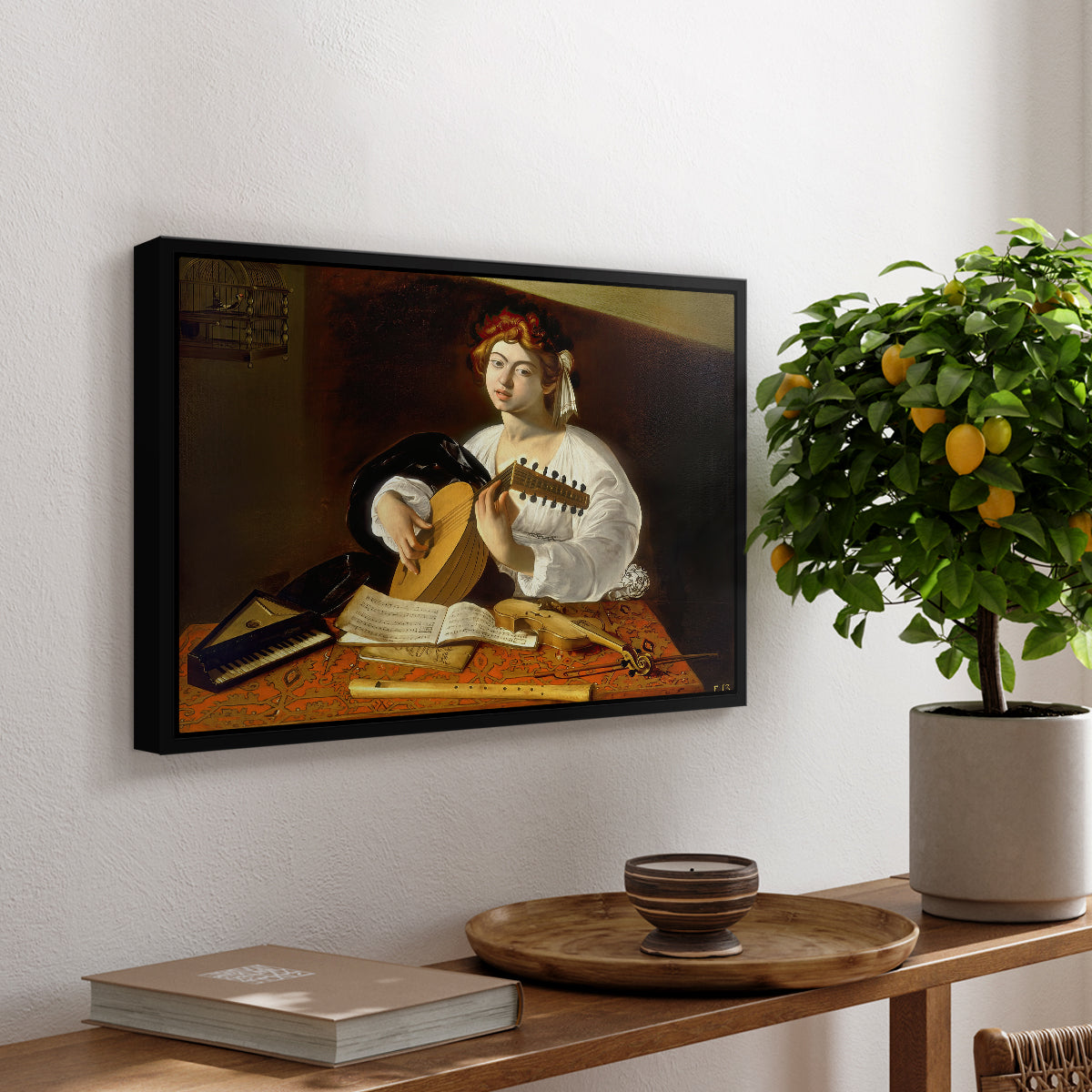 The Lute Player (Wildenstein Version), c. 1596 by Caravaggio, presented in a black floater framed canvas featuring a young man playing lute surrounded by sheet music and still life objects, displayed above a hallway console table.