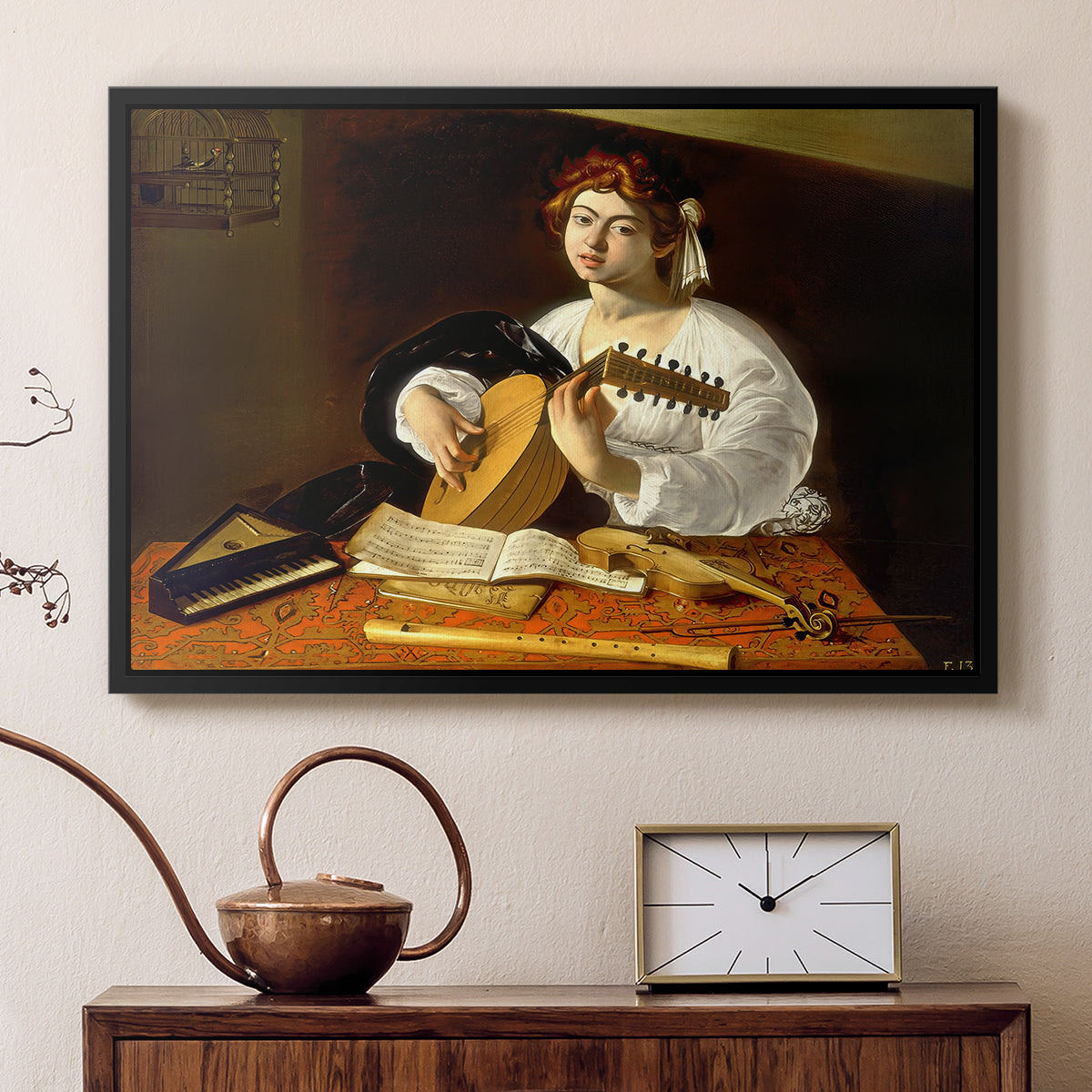Black floater framed canvas featuring a detailed scene of youth playing string instrument with fruit and flowers nearby, displayed above a cabinet in a soft-toned living room.