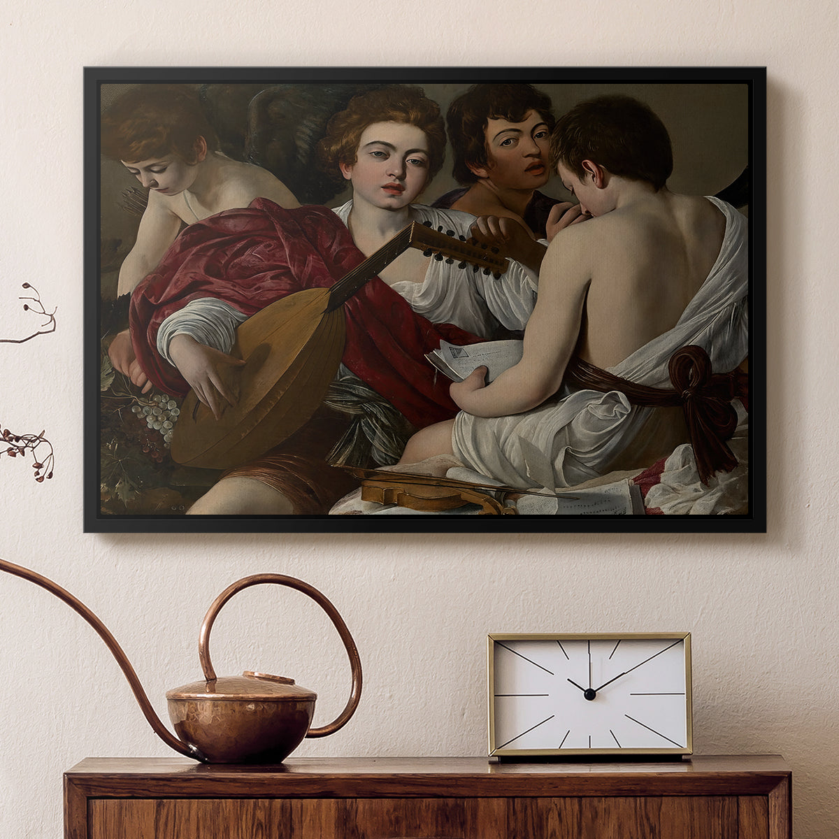 Black floater framed canvas featuring an intimate scene of youths making music with sheet music and instruments, displayed above a cabinet in a soft-toned living room.