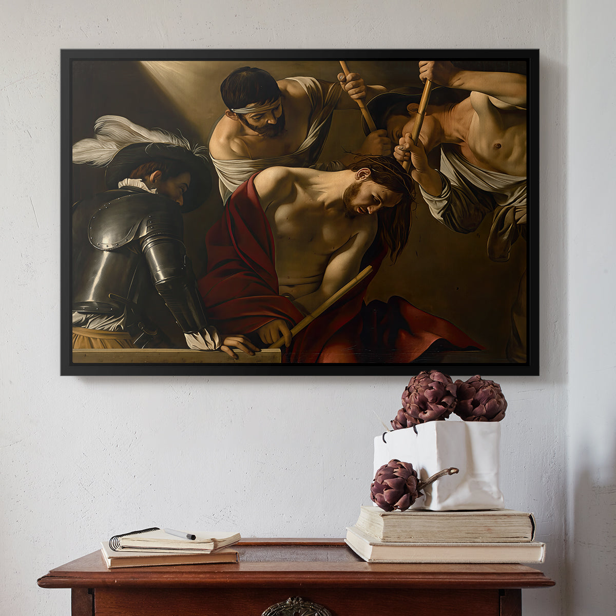 Black floater framed canvas featuring The Crowning with Thorns (Vienna Version), c. 1602-1604 by Caravaggio above an entryway table in a minimalist foyer.