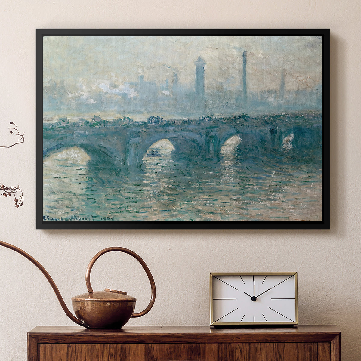 Black floater framed canvas featuring a soft-toned river scene with bridge and muted skyline, displayed above a cabinet in a soft-toned living room.