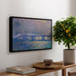 Charing Cross Bridge, 1903 by Claude Monet, presented in a black floater framed canvas featuring an impressionist view of bridge stretching across river with soft light and haze, displayed above a hallway console table.