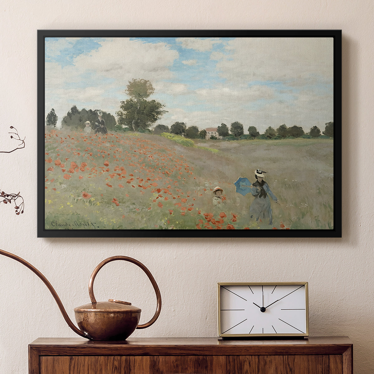 Black floater framed canvas featuring a bright meadow filled with poppies under open sky, displayed above a cabinet in a soft-toned living room.