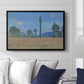 Poppy Field (Giverny), 1890-1891 by Claude Monet displayed above a sofa in a living room in a black floater frame, featuring an impressionist landscape of blooming poppies in countryside.