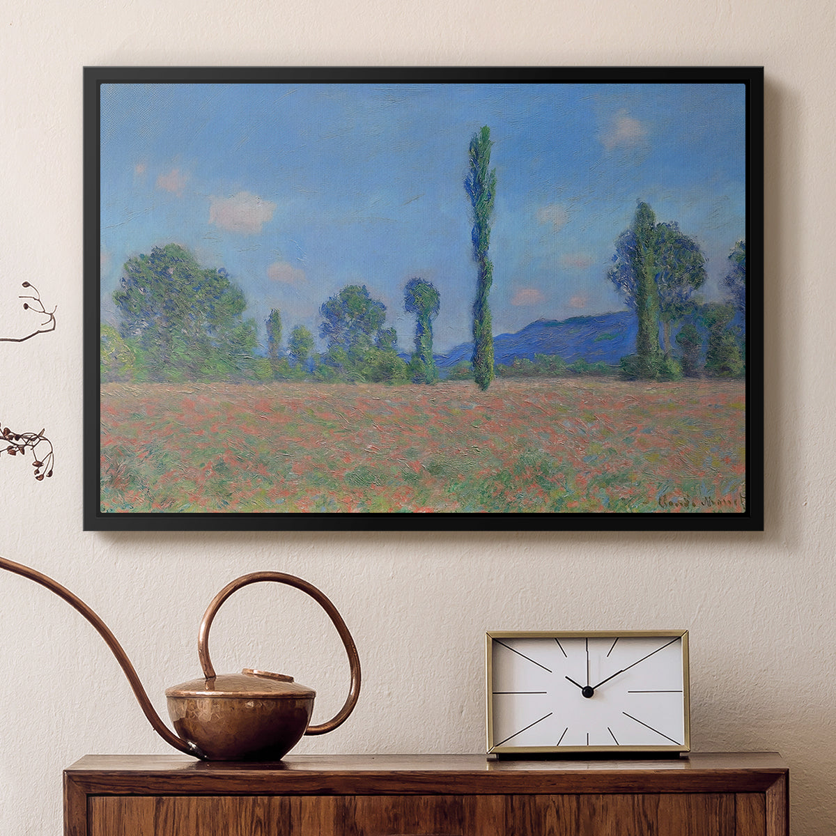 Black floater framed canvas featuring a vibrant meadow scene with flowers and vertical tree forms, displayed above a cabinet in a soft-toned living room.