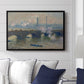 Waterloo Bridge, Gray Day, 1903 by Claude Monet displayed above a sofa in a living room in a black floater frame, featuring an impressionist depiction of bridge with soft gray tones and haze.