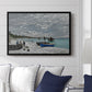 The Beach at Sainte-Adresse, 1867 by Claude Monet displayed above a sofa in a living room in a black floater frame, featuring a lively beach scene with people overlooking water and ships.