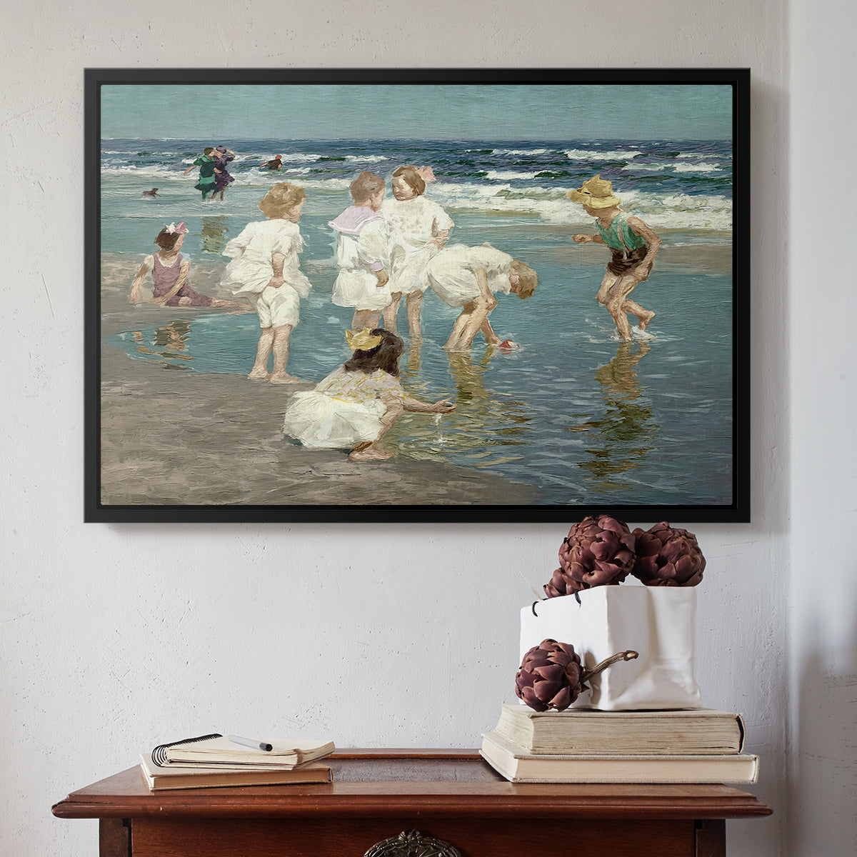Black floater framed canvas featuring A Holiday, c. 1915 by Edward Henry Potthast above an entryway table in a minimalist foyer.
