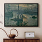 Black floater framed canvas featuring an early morning harbor scene with boats and diffused light, displayed above a cabinet in a soft-toned living room.