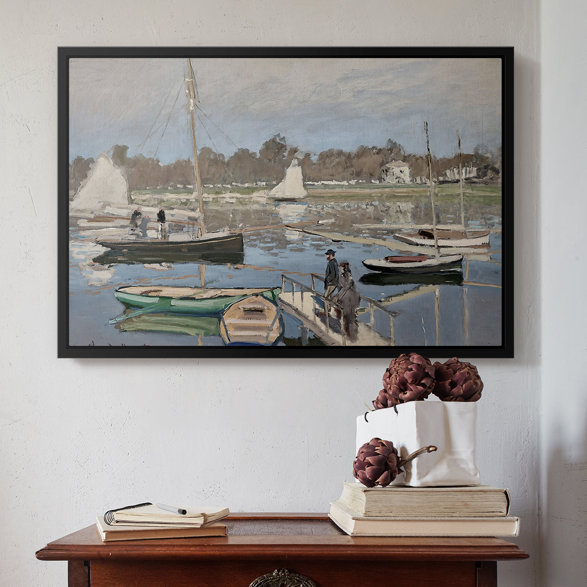 Black floater framed canvas featuring The Basin at Argenteuil, 1874 by Claude Monet above an entryway table in a minimalist foyer.