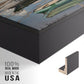 Close-up of the black floater frame corner and gallery wrapped canvas construction.