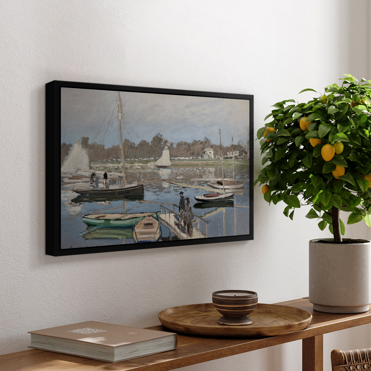 The Basin at Argenteuil, 1874 by Claude Monet, presented in a black floater framed canvas featuring sailboats gathered in calm basin with reflections on water, displayed above a hallway console table.