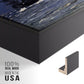 Close-up of the black floater frame corner and gallery wrapped canvas construction.