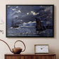 Black floater framed canvas featuring a dramatic ocean scene with light reflecting across water at night, displayed above a cabinet in a soft-toned living room.