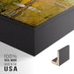 Close-up of the black floater frame corner and gallery wrapped canvas construction.