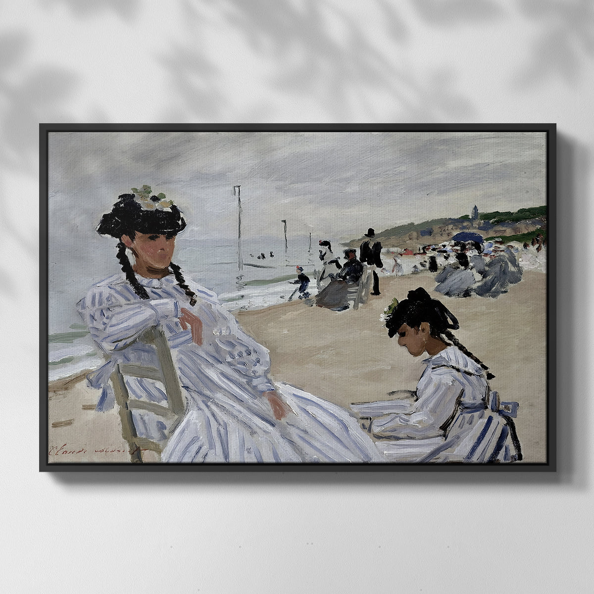 Front view of On the Beach at Trouville, 1870 by Claude Monet in a black floater framed canvas.