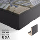 Close-up of the black floater frame corner and gallery wrapped canvas construction.