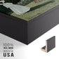Close-up of the black floater frame corner and gallery wrapped canvas construction.