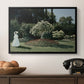Woman in the Garden, Sainte-Adresse, 1867 by Claude Monet in a black floater framed canvas displayed above a console table in a hallway, featuring a tranquil garden portrait with soft natural light.